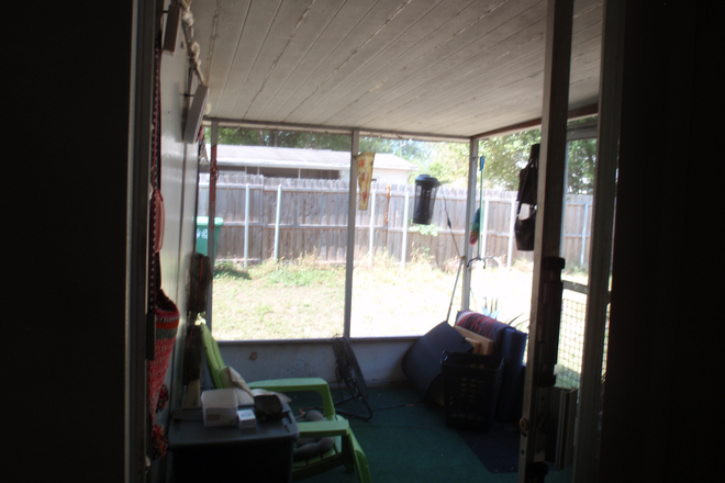 One side with added kitchen table, microwave, freezer and refrigerator - Patio Bungalow Efficiency on Private Property, Close to Campus