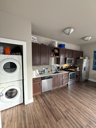 Washer dryer & kitchen - The Lux Apartments