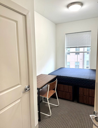 Bedroom: includes spacious closet, carpet, 2 drawers (movable), desk and chair, blinds, smoke detector, window overlooking courtyard - Landmark Apartments