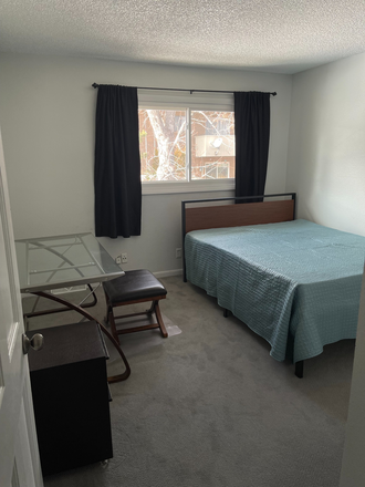 View of the bedroom with included furniture (bed, desk, dresser) - Townhouse near trails, easy access to campus, 1 room available now!