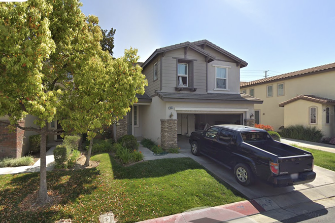 Front view of the house at 4552 Filson St a beautiful two-story home in a quiet, safe neighborhood with plenty of parking and greenery. - Rent a room of 4552 Filson St  in a quiet, safe neighborhood next to UCR House