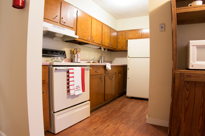 Kitchen in a Two Bedroom - Collegiate Arms Apartments