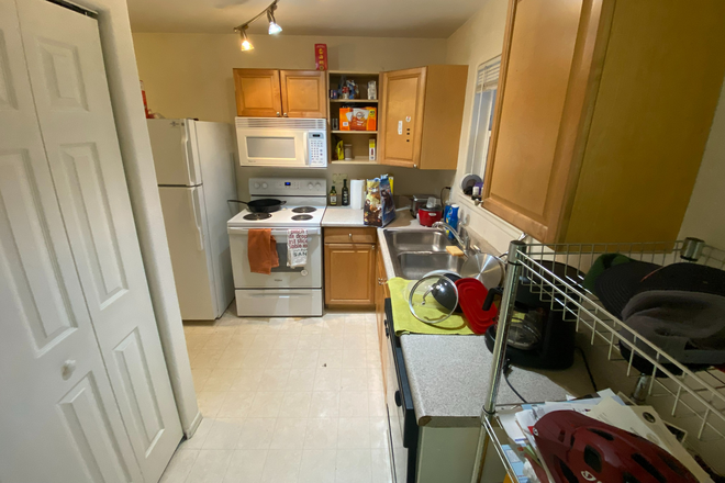 This is the view as you walk through the front door. Exposed cabinet does have a door that I removed, I will replace before moving out. - PG Rentals 30th Street Units