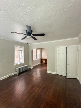 Living Room - Mayfield - Classic 1BR Steps from Lake View Cemetery | $995 Incl Parking, Heat, Water Utility