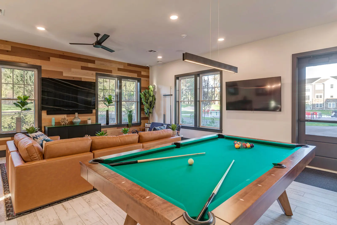 Clubhouse pool table and couch - North116 Flats Apartments