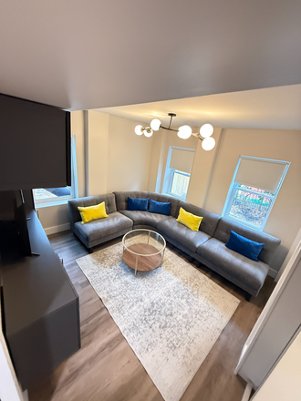 Living room sectional - Utilities included and fully furnished Duplex