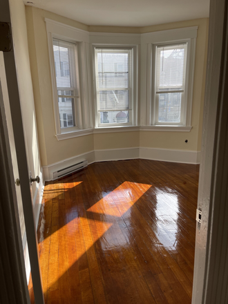 Visit hubrealtyproperties.com - Mission Hill, sunny front facing 2 bedroom split on Green line T Apartments