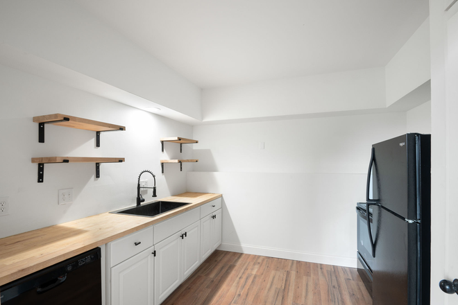 Updated kitchen with full-size appliances and plenty of cabinet space. - Mohawk Hill Apts