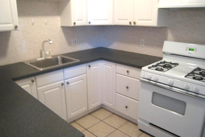 visit hubrealtyproperties.com - Available 9/1/25, huge 4 bedroom 2 bathroom condo across from West campus