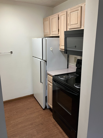 Kitchen: stove, microwave, & fridge - 2B/1B Apartment for Summer Sublease