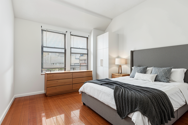 Bedroom (Note: Staged photos are digitally rendered and intended to illustrate how the unit may look furnished.) - 1204 Chestnut Apartments
