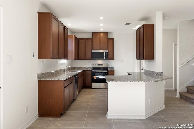 Kitchen with dishwasher/range/microwave oven/garbage disposal unit/refrigerator/cabinets - Students or Faculty: Brand new 3 bedroom/2.5 bath home only 5 miles from A&M Campus