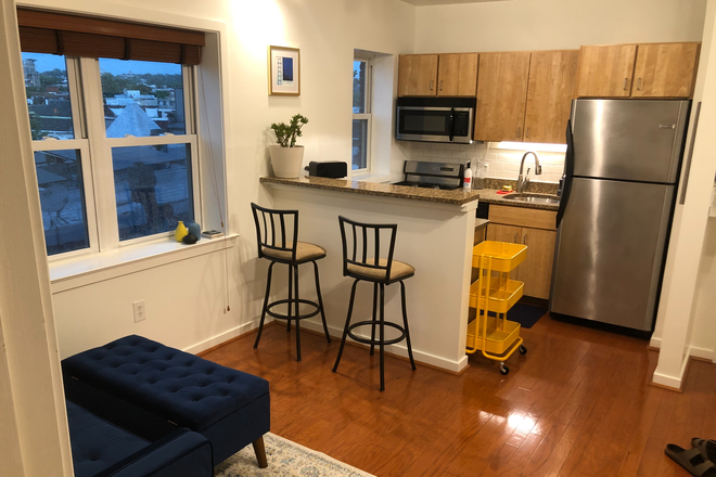Living Room/Kitchen. - 1BR Corner Unit in Columbia Heights, Private Parking Included (15 min walk to Howard)