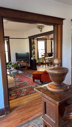 Living Room View with Television and Chain - Cute House Across Campus