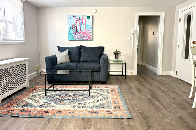 Living Room - View from Kitchen - Furnished 1 Bedroom Apartment. Heat & Hot Water Included. Great Location!