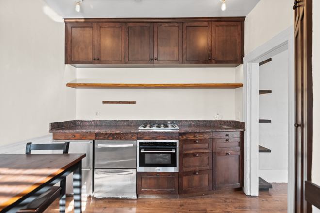Kitchen with undercounter fridge and freezers - Unique Hardwood Cabinetry w/ Hot Tub Access