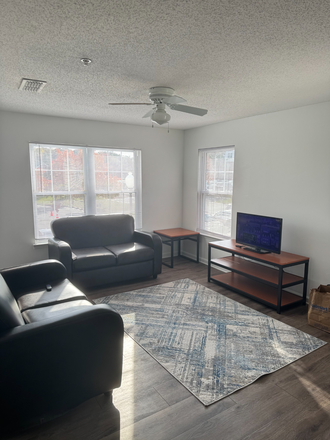 living room - The Courtyards UMD - 300$ signing bonus Apartments