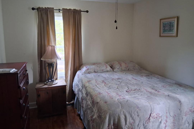 Bedroom upstairs end of the hall - James Island furnished PRIVATE HOME