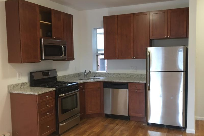 Visit hubrealtyproperties.com - Prime location, beautiful 3 bedroom 1.5 bathroom with street views, on green line T Apartments
