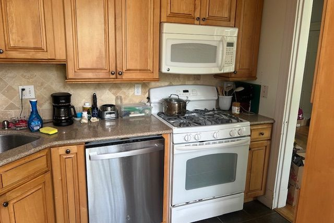 Kitchen with microwave, stove, dishwasher, garbage disposal, refrigerator, lots of storage - Looking for 1 Roommate in Beautiful 2 Bedroom Coolidge Corner Condo in Beautiful Courtyard