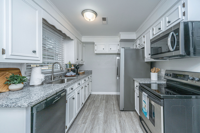 Kitchen - Serving utensils, wine and drinking glasses, juice glasses, coffee mugs, plates and bowls to serve up to 8 guests. - James Island home close to downtown Charleston