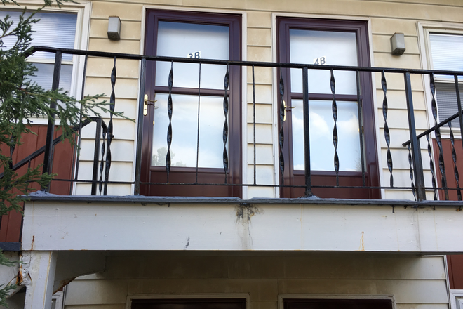 Front balcony - Nice quiet close in Study Apartment for Grad Student in residential area a few blocks from campus.