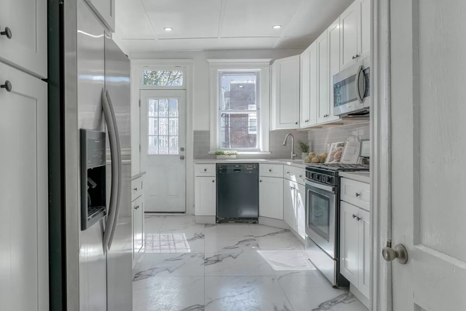 Kitchen from Entryway - Summer 2025 Special: Charming Maryland-Themed Room at "The Baltimore" Townhome