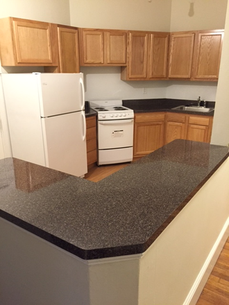 Visit hubrealtyproperties.com - Brookline, spacious 2 bedroom split with large kitchen and deck