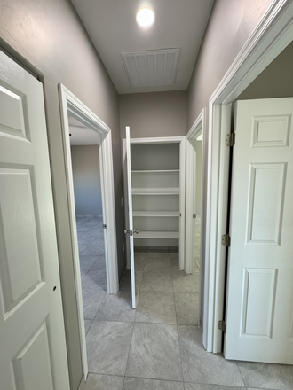 hallway with pantry and laundry room - 328 E Lester Street