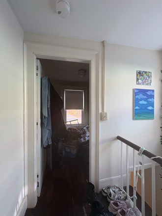 Storage space near staircase entrance (currently used for suitcases and coats) - Apartment above a dentist close to campus