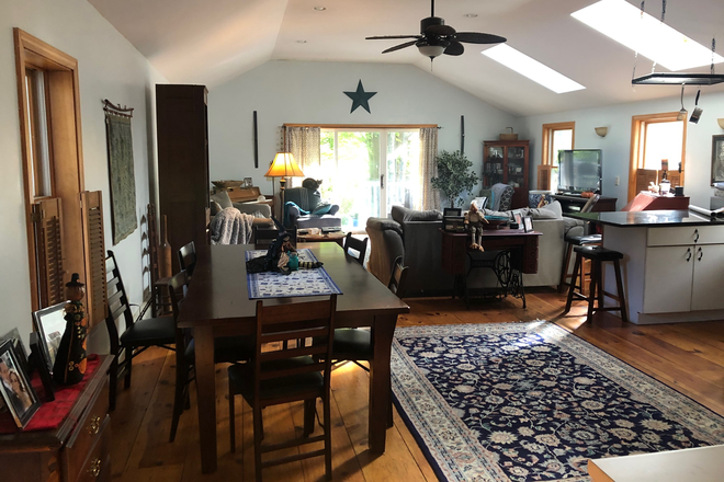 Livingroom with sliding glass  doors out to deck - Country Cottage - on the Mill river
