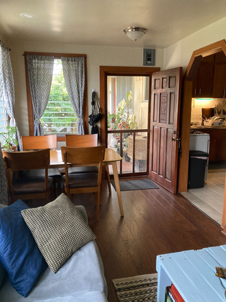 Dining area - bright, breezy, overlooking mango tree! - Immaculate, Oversized 3BR 1Ba 2 Pkg House* Nearby UH (2.2 mi.)*Avail June😸OK!
