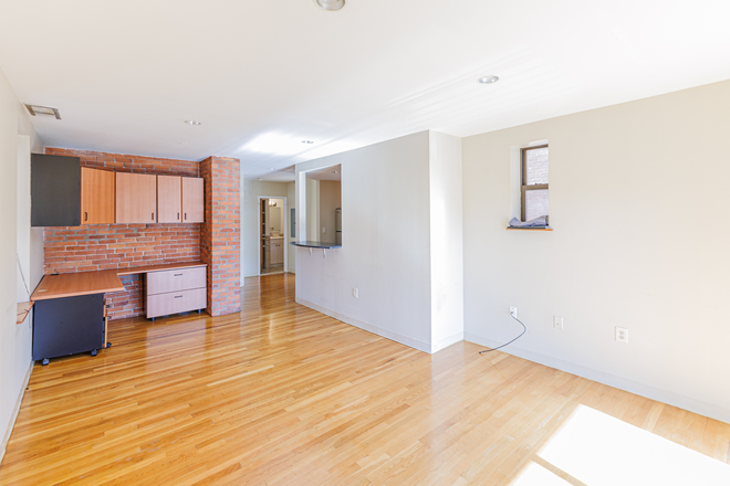 living room - Sunny Fenway 1 bed with in unit laundry, AC, and private deck for 6/1 - NO FEE! Apartments