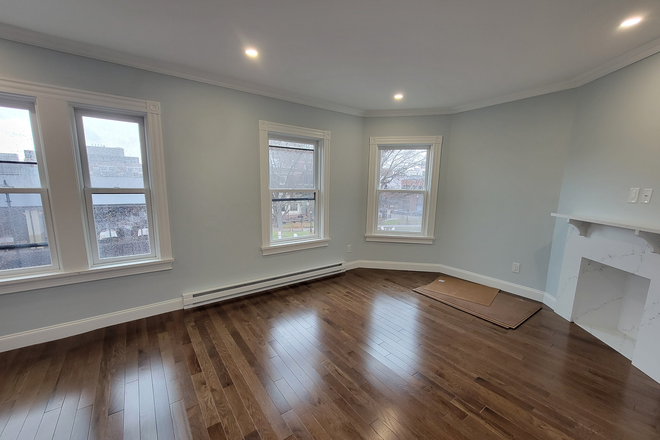 Living Room - Harvard Square Newly Renovated 1 Bed. Park Views! LL pays Fee! Apartments