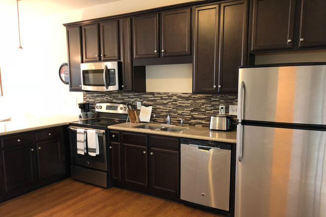 Kitchen includes stainless steel appliances & quartz countertop - Great Location - Walk to Centennial Campus- close to main campus Townhome
