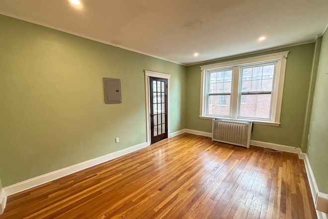 Living Room - AVAILABLE NOW - BEAUTIFUL 1 BEDROOM NEAR BC CAMPUS (HEAT AND HOT WATER INCLUDED) NO FEE! Apartments