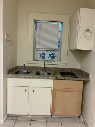 Kitchen area w/induction stove - Furnished 2 bedrooms Apartment 1 min walk to west campus