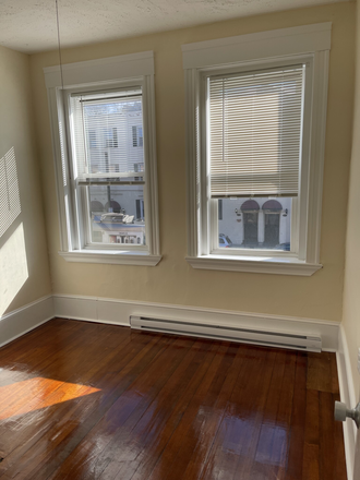 Visit hubrealtyproperties.com - Mission Hill, sunny front facing 2 bedroom split on Green line T Apartments