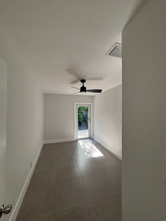 BEDROOM WITH DOOR TO PATIO - 5 Bed/ 2.5 bath pool home with yard and laundry