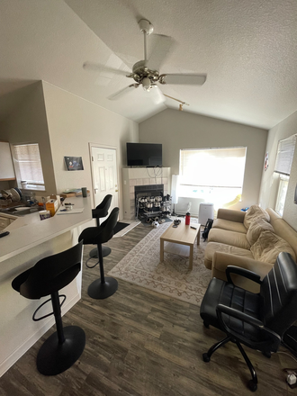 Living room (desk outside the right of the frame) - 4-plex apartment housing close to campus