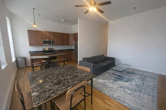 living - STUNNING 4 BED WITH HEAT/HOT WATER INCLUDED! NO BROKER FEE, AVAIL 9/1/26!