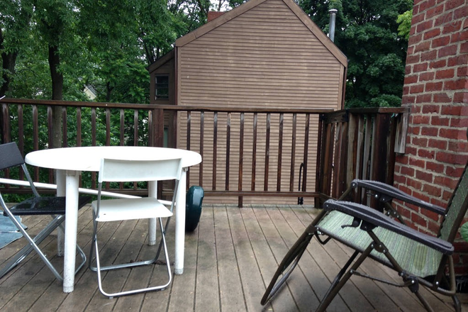 kitchen door leads to outdoor deck - Fully furnished third floor apt. in Harvard Square including all utilities