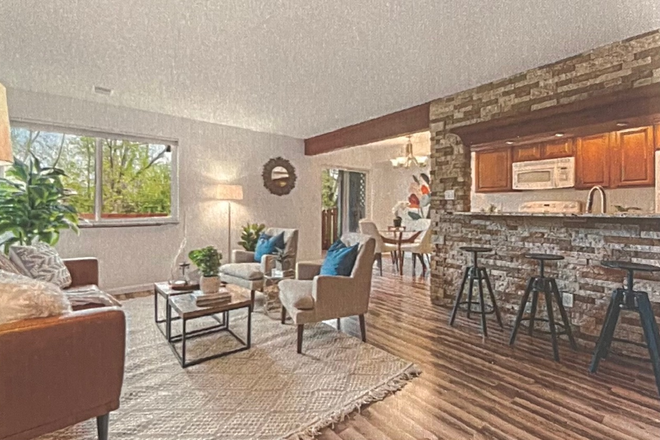 Living room, dining nook, kitchen bar (not current furniture) - 1 bedroom available in 2br townhouse across from CU east campus - Spring 2026 lease