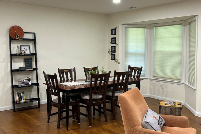 Dining area with view of lush green area off the Canal - Furnished 2BR/2 bath condo-Acadia Ct-Princeton