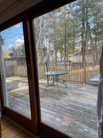 Sliding door opens to private deck looking to backyard - Private room in a shared home-Wilder Ave-Princeton