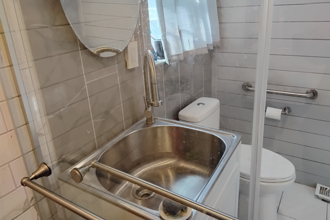 Shared bath sink, mirror and commode - Furnished Room Available, International Guest Welcome House