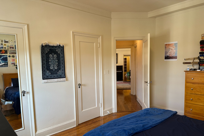 Bedroom w/ hall door open - Furnished room & apartment at 100 W. University Parkway