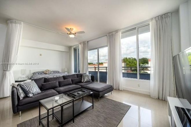 Living area - Open curtain in back for bedroom view - Coco Style Condo