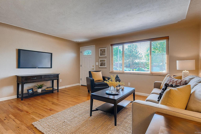 living room - Two bedrooms available August 1! Spacious four bedroom home steps away from Claver Hall...