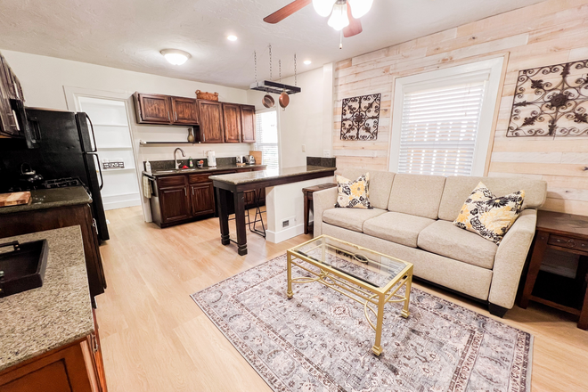 Living room with pull-out couch - Fully Furnished 1Bedroom Apartment - Prime SLC Location